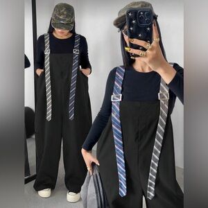 Stylish Black Jumpsuit with Striped Suspenders